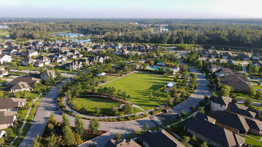 Aerial of Starkey Ranch showing neighborhoods, streets, ponds, and the community park green.